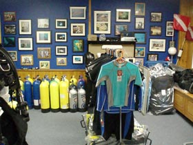 Photo of Ocean Horizons Scuba shop in Brooklyn. Shows scuba gear and oxygen tanks.